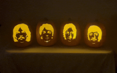 Set of four foam pumpkins hand-carved with Beatles member faces, Halloween decoration made with hot knife cutting technique