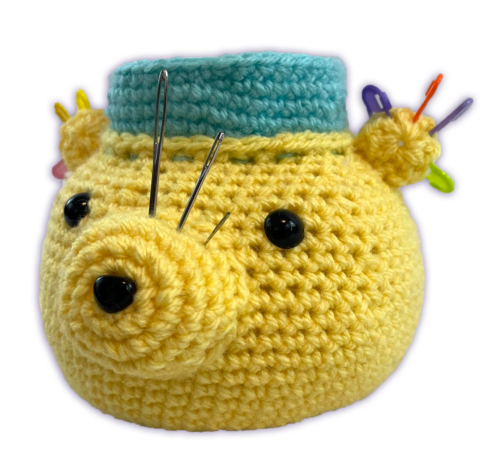 An angled view of yellow crochet bear desk organizer, showing ear stitch marker holder and rounded body shape