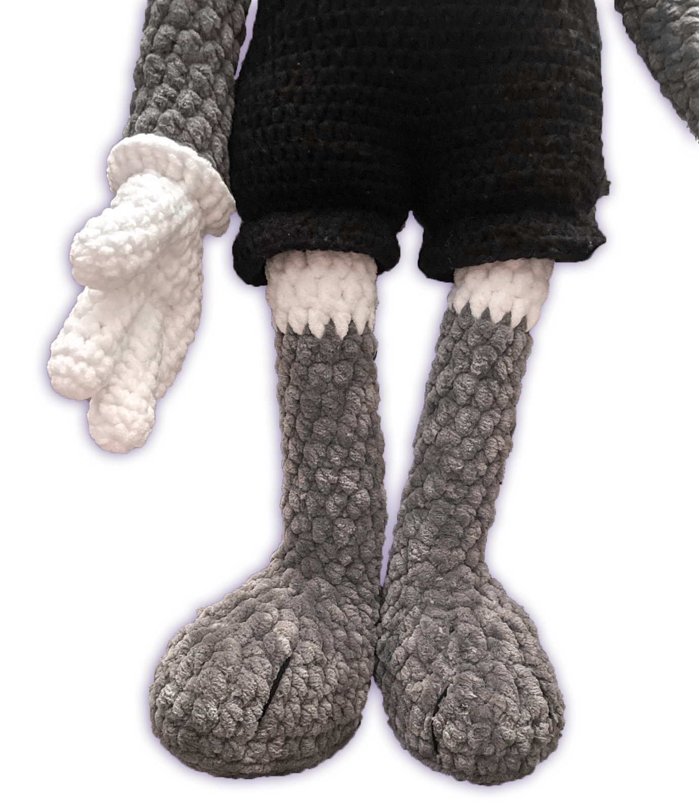 Close-up of crochet fox toon plush feet, handmade paw construction detail