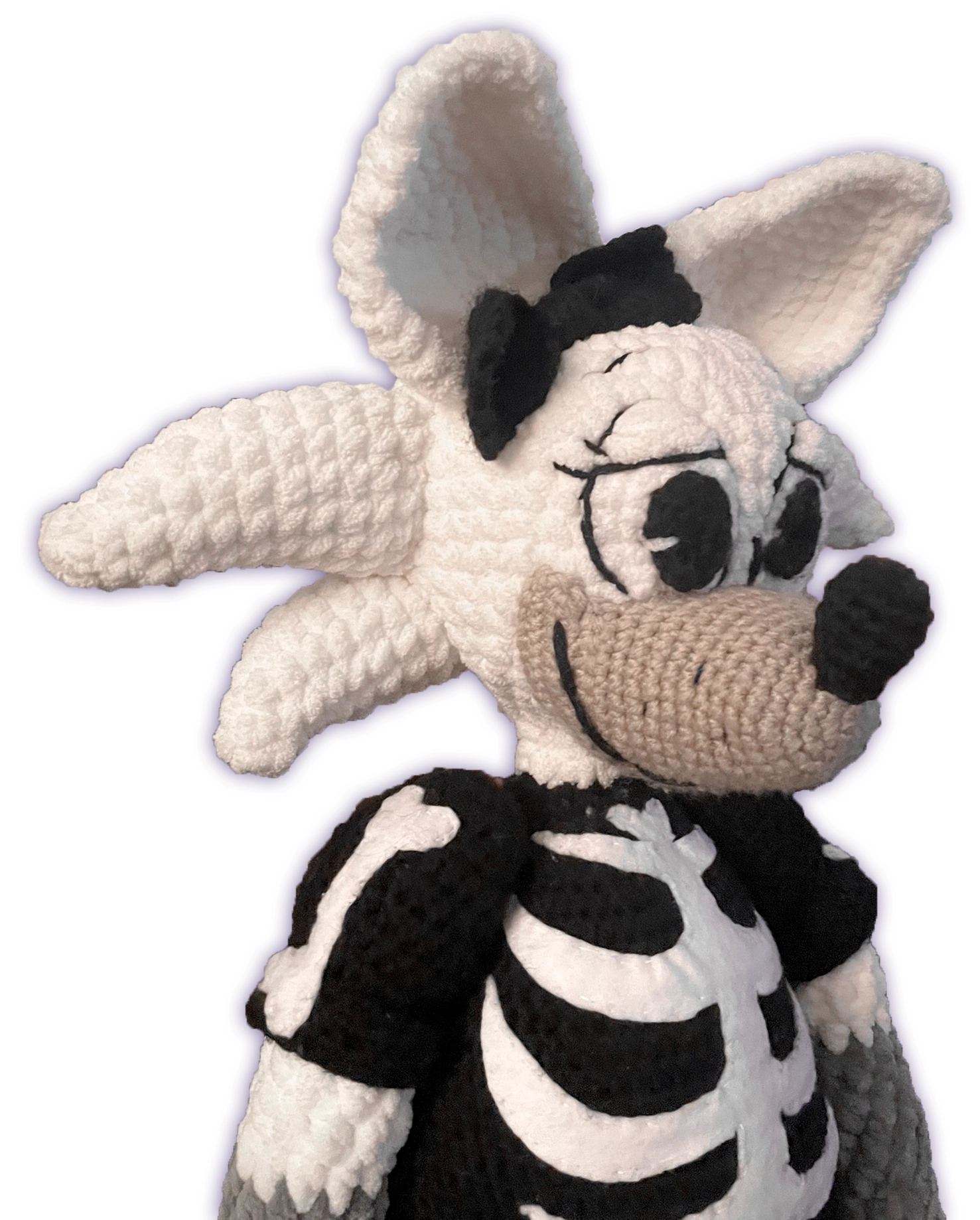 Side view of crochet fox toon plush, creamy-white and gray fox anatomy detail