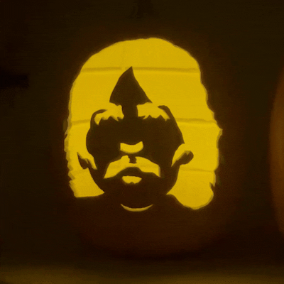 George Harrison foam pumpkin carving, Beatles-themed Halloween decor with hand-cut silhouette detail