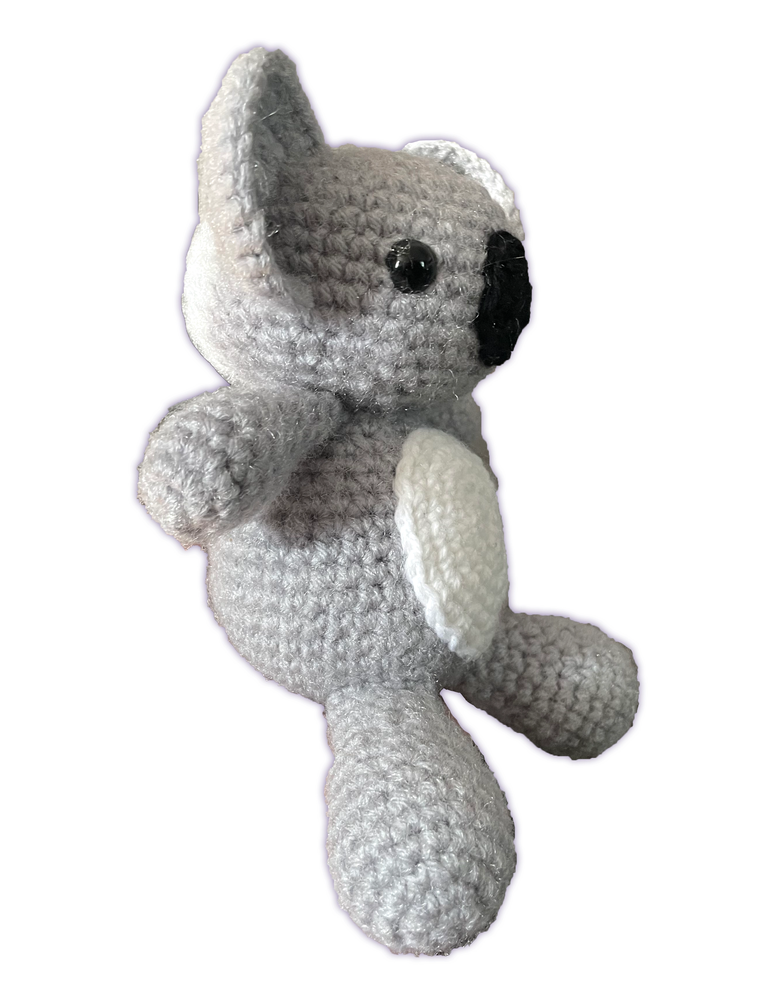 Crochet koala stuffed animal, side profile view showing rounded ears and body shape, handmade amigurumi