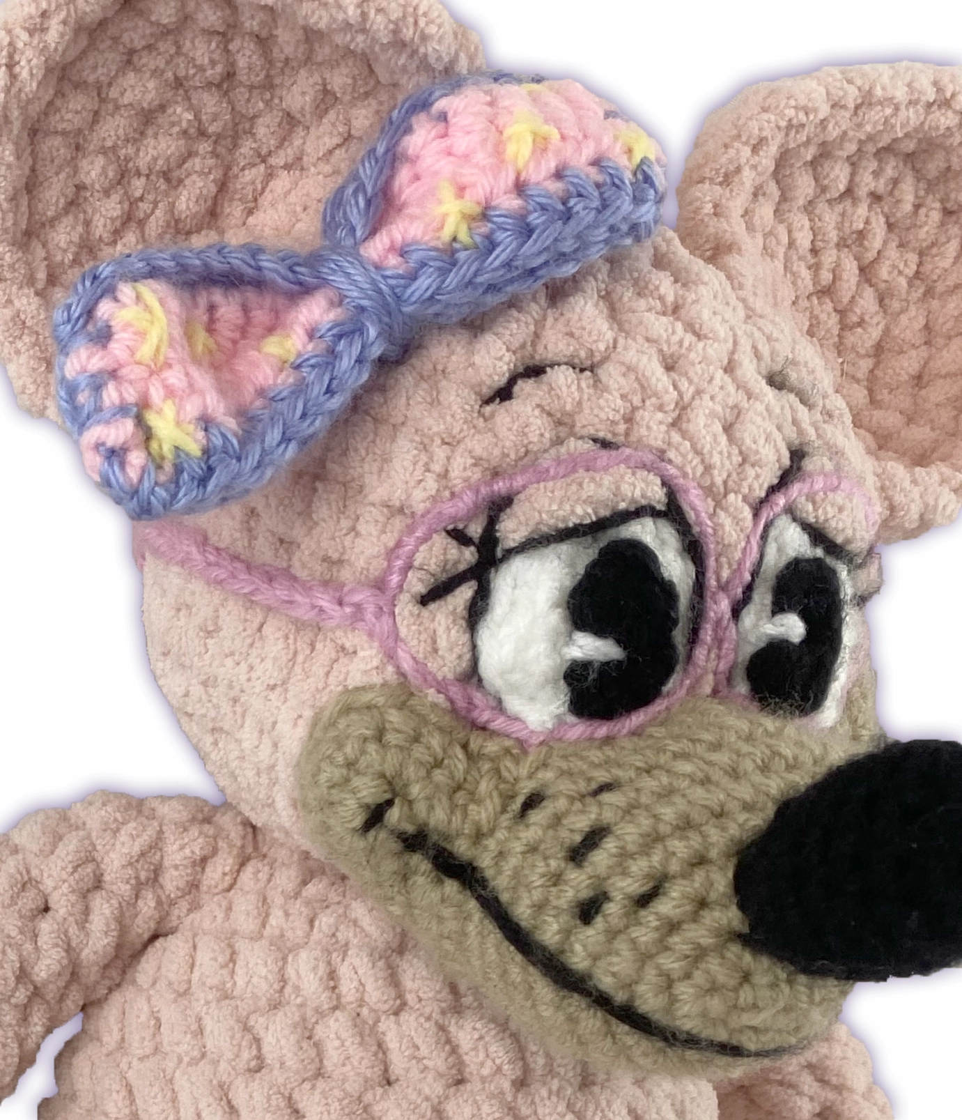Close-up side view of crochet mouse toon plush, handmade stitch detail