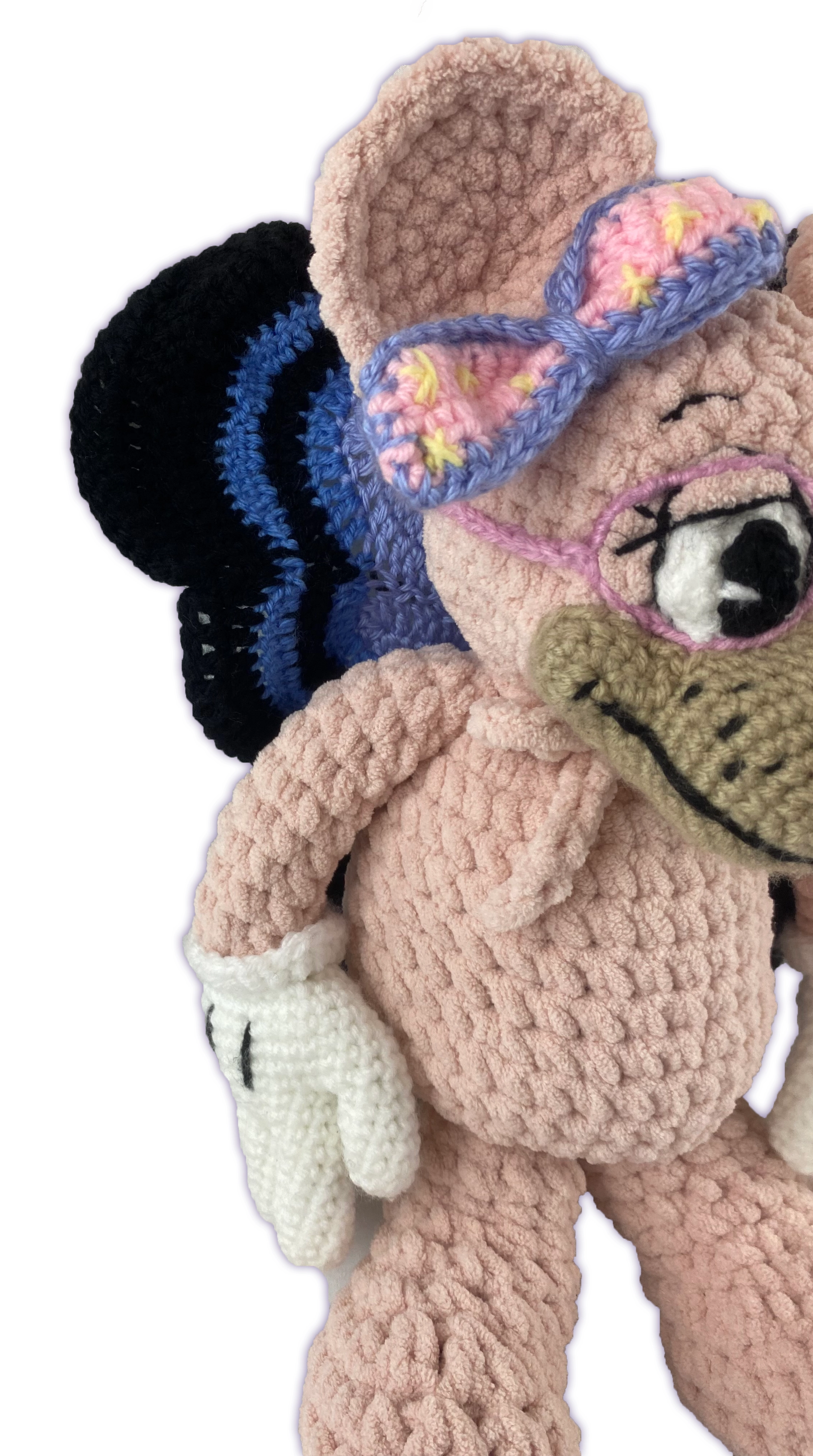 Side view of crochet mouse toon plush with removable butterfly wings, wired to hold shape