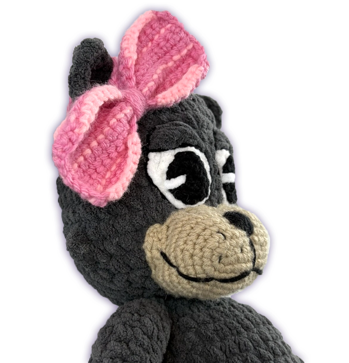 Opposite side view of Pancake crochet toon plush face, handmade toon detail, bow on display