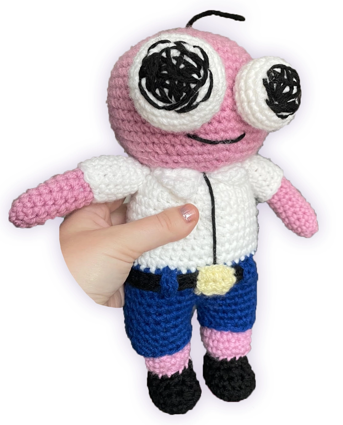 Crochet Pim plush held in hand, side view showing scale and amigurumi design