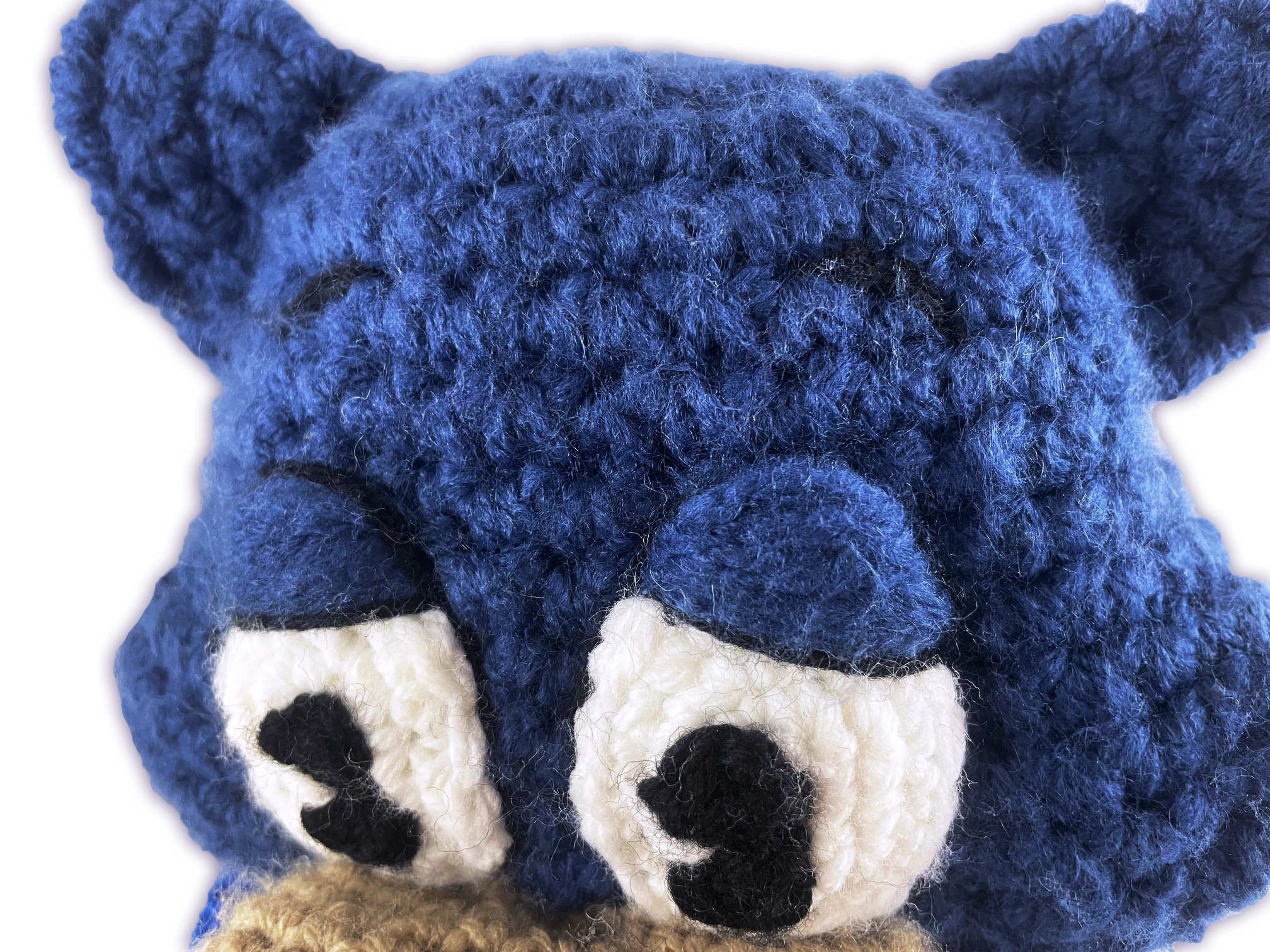 Close-up of crochet Pixie Toontown plush eyebrow detail, handmade toon facial feature