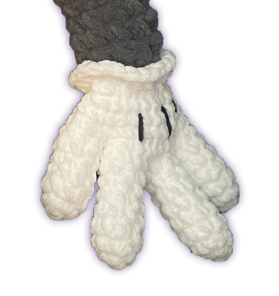 Close-up of Spicy T-Bone crochet toon plush hand, handmade toon glove detail