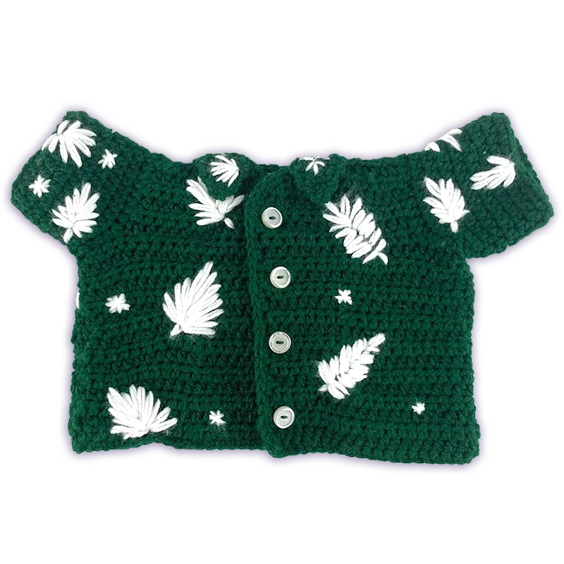Green crochet shirt for a stuffed animal with buttons and leaves.