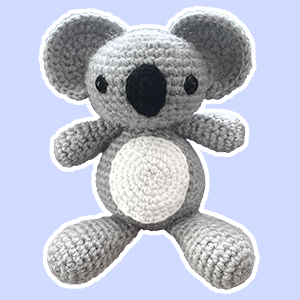 Handmade crochet koala plush toy with large ears and white belly