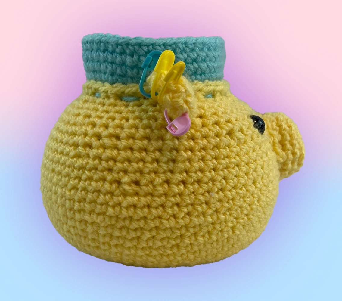 Side angle of crochet bear pin cushion showing 3D structure