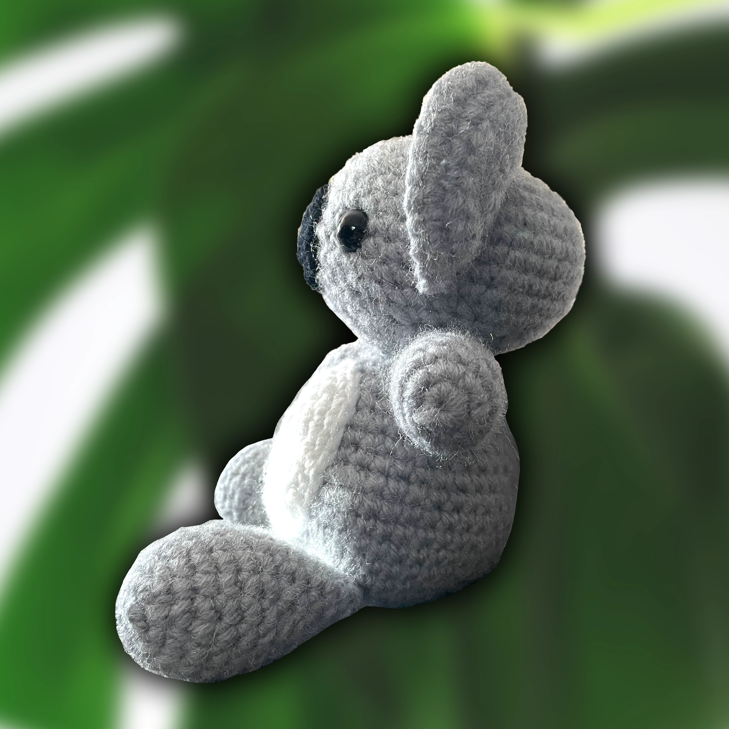 side view of gray, soft crochet Koala