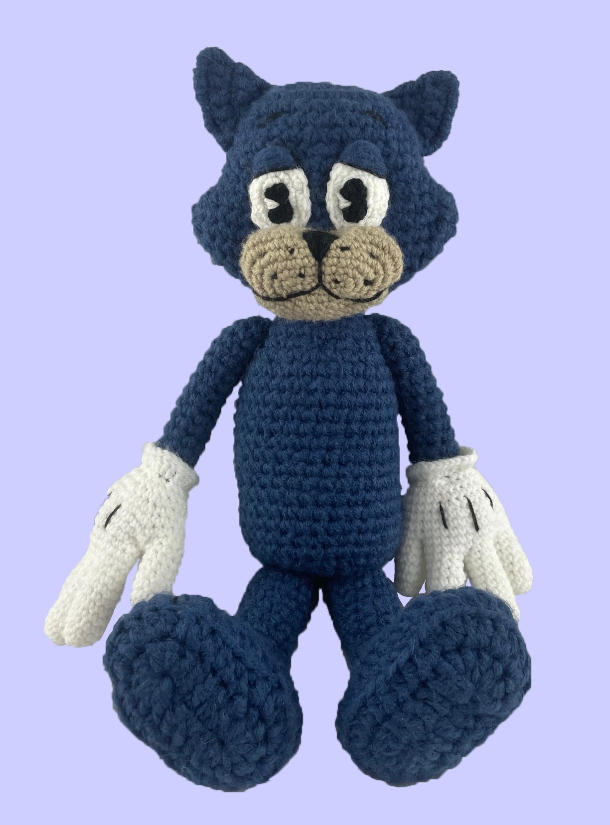 Custom crochet Toontown plush of blue cat character, sitting without clothes. Shows full handmade design and stuffed plushie body details.