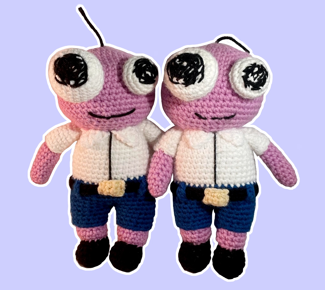 Two crochet Pim plushies side by side with slight customization differences