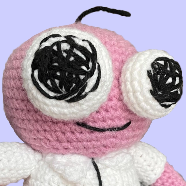 Side profile of crochet Pim plushie from Smiling Friends